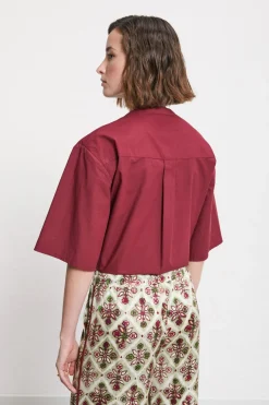 Blouse en coton avec broderie à oeillets