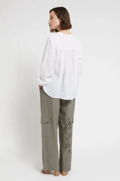 Pantalon en coton avec broderie à oeillets